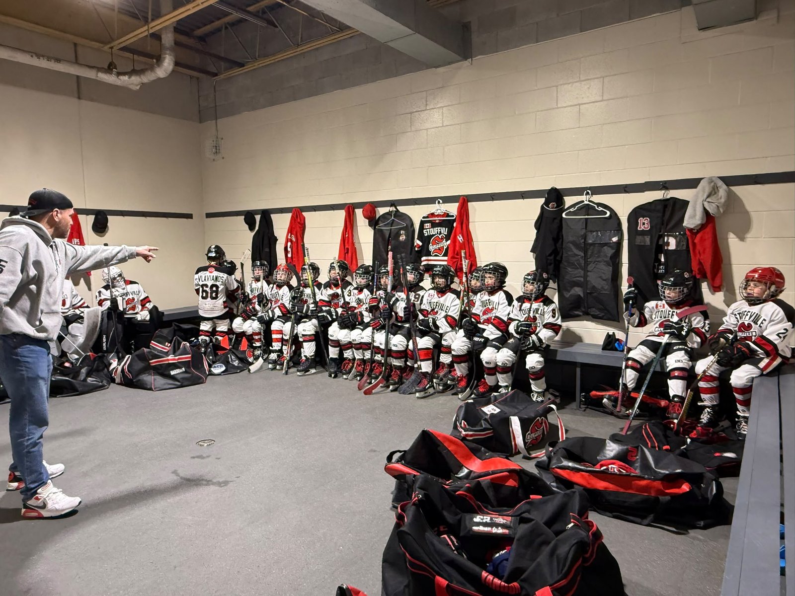 Coach going over the game with the Clippers in the locker room